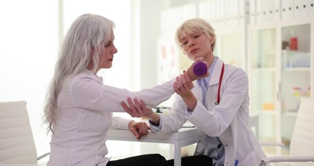 Senior woman with dumbbells and physiotherapy rehabilitation nurse helps in fitness and muscle support. Medical physiotherapist with hand of elderly patient