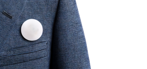 A close-up view of a stylish blue suit jacket featuring a polished white button, perfect for fashion and business themes.