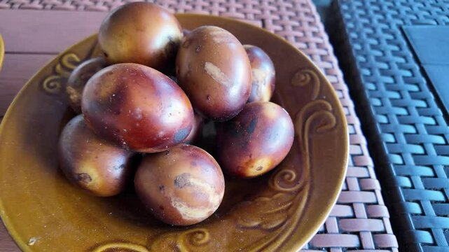 Salted Roasted Egg is a traditional dish from Brebes, Central Java, Indonesia. It is made from duck eggs that are salted and then roasted, giving it a delicious smoky aroma