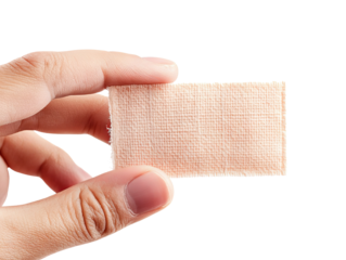 A hand holding a medical bandage, symbolizing first aid and health care. Ideal for themes related to injury treatment and safety.