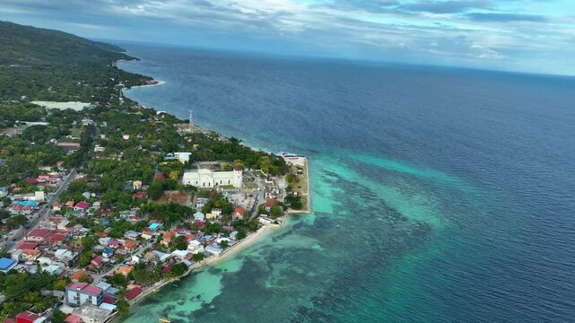 Cuartel Ruins, Quartel Beach, And Church On Coast Of Oslob In Cebu, Philippines. aerial shot