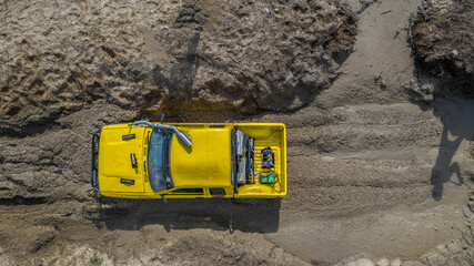 Aerial view off road pick up 4WD car vehicle, Pick up car 4WD wheel drive off road. © Kalyakan