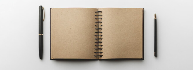 A blank notebook with a spiral binding, open on a white background, with a pen beside it. Created with Ai