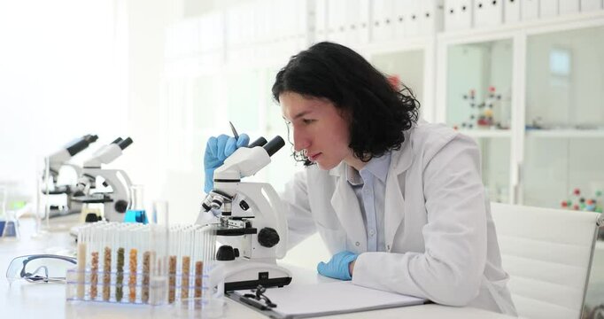 Lass test tubes with food additives cereals and grains in laboratory. Qualitative and quantitative determination of genetically modified organisms GMO of plant origin