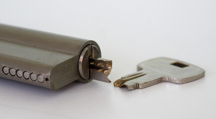 Close-up of broken key and lock with half key inside