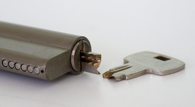 Close-up of broken key and lock with half key inside