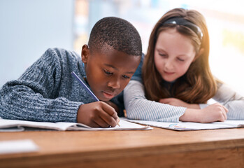 Students, writing and book for education in classroom of learning, study quiz and drawing assessment. Kids, stationery and helping with creative test, sketch colour and lesson activity of development