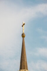 church tower with a cross at the top in santa maria cathedral Samarinda