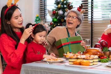 Family members gather to enjoy a meal together during the Christmas holiday at home