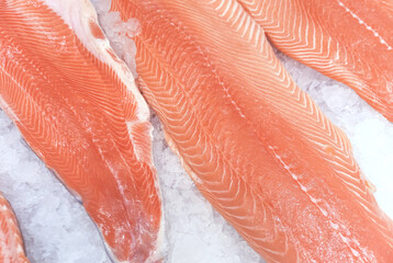 Raw salmon steaks on crushed ice