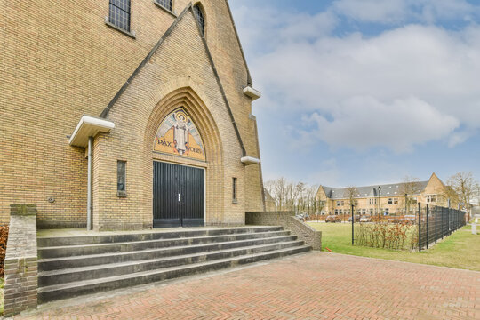 Traditional brick church entrance with mosaic detail