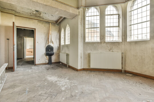 Abandoned room with peeling walls and debris