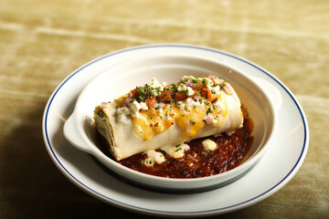 Enchiladas, a mouthwatering Mexican delight. This image captures the savory, rolled tortillas smothered in flavorful sauce
