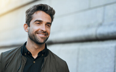 Smile, man and relax for travel in city on vacation, explore outdoor and sidewalk commute to destination. Happy, male person and confidence for stylish clothes, building and sightseeing of holiday