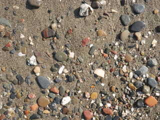 Background of river stone and sand on the beach seashore