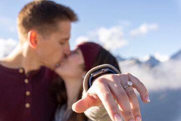 Romantic engagement day with ring and mountain backdrop