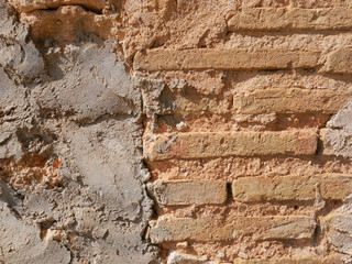 Distressed wall surface. Grunge brown and orange stone wall
