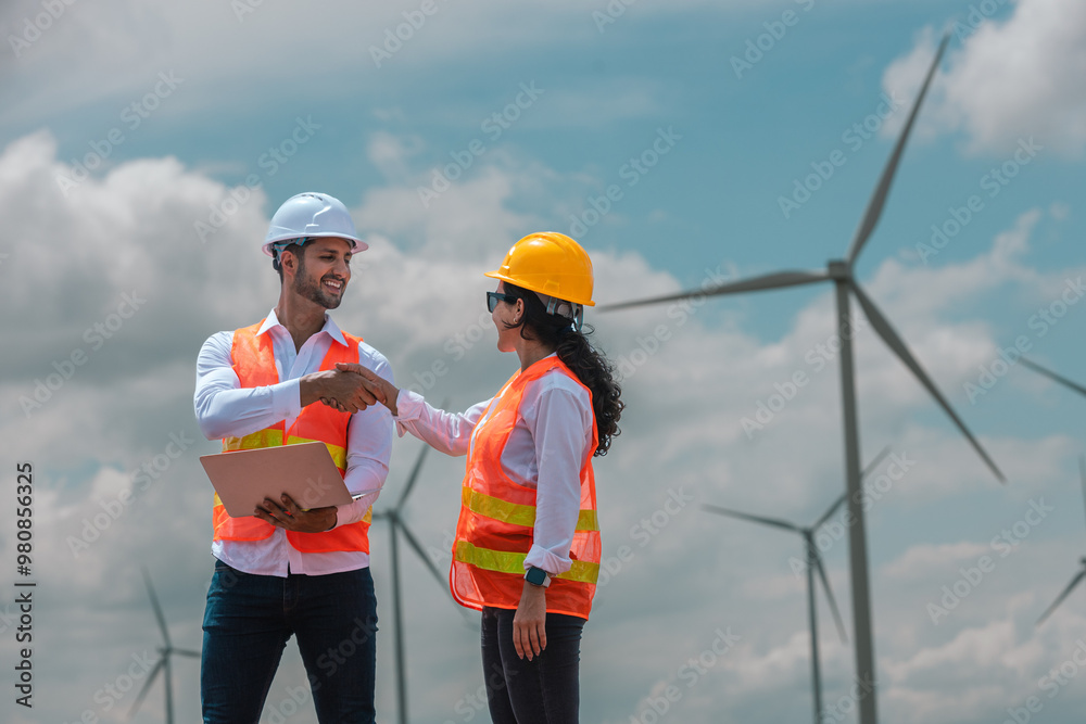 Aufkleber man and woman engineer worker wind turbine handshake success agreement survey discuss operational pl