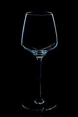 Empty wine glass on black background