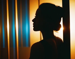 Dark silhouette of a woman indoors 