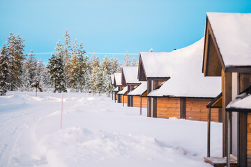 Wooden Igloos Standing in a Row in the Snow