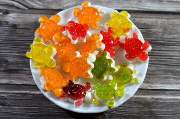 gummy candies shaped like turtles, soft and chewy with a variety of fruity flavors in each gummy turtle shaped candy, delightful blend of sweetness and tanginess made of water, sugar, gelatin