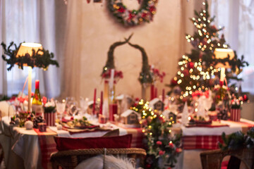 Christmas table setting indoors Christmas decoration in classic red and gold color scheme