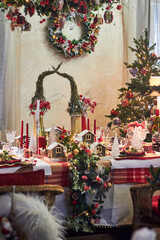 Christmas table setting indoors Christmas decoration in classic red and gold color scheme