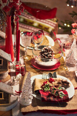 Christmas table setting indoors Christmas decoration in classic red and gold color scheme