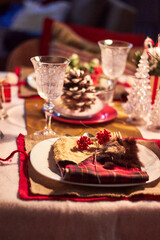 Christmas table setting indoors Christmas decoration in classic red and gold color scheme