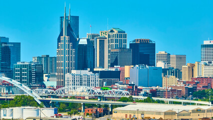 Aerial View of Nashville Skyline with Pedestrian Bridge and Riverfront