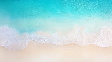 Aerial view of a pristine beach with turquoise waves gently crashing onto white sandy shore, evoking tranquility and relaxation.