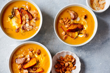 Creamy baked pumpkin soup with pumpkin seeds and almonds .style hugge
