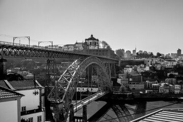 Steel Bridge and City (Porto, Portugal) Panorama.
A classic view of a steel bridge arching over a vibrant cityscape, showcasing the fusion of historical architecture and modern urban life.