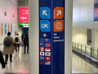 Passport Control and UK Border signage in the public area at Heathrow Airport London England