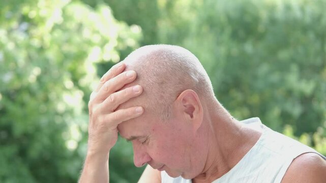 unhappy senior, man 60-65 years old with closed eyes, crying bitterly, covering eyes with hands, tears streaming down, aged grief, emotional distress, tearful elderly