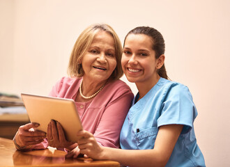 Healthcare, portrait and tablet of nurse with old woman in assisted living home for diagnosis or results. Medical, smile or tech with caregiver and senior patient in clinic together for consulting