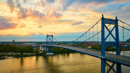Naklejka premium Aerial View of Anthony Wayne Bridge at Sunset Over Maumee River