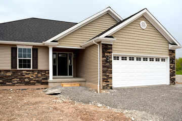 New Home Under Construction with Lumber Framing and Carpentry Builders Craftsman