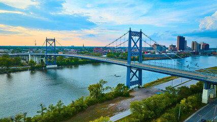 Naklejka premium Aerial View of Anthony Wayne Bridge at Sunset Over Maumee River in Toledo