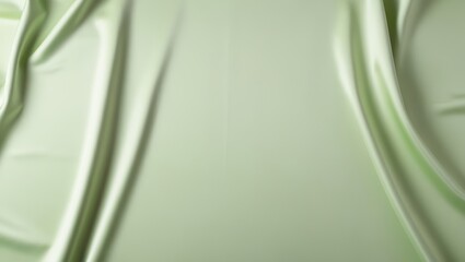 Smooth light green silk fabric with gentle flowing drapery, showcasing its soft texture and subtle shine.