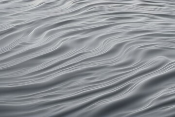 Obraz premium A muted stone gray water ripple background with smooth gentle waves, AI Generated
