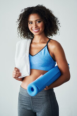 Exercise mat, smile and portrait of woman in studio for self care, wellness and fitness in morning. Confident, athlete and person with towel for training, workout and healthy body on white background