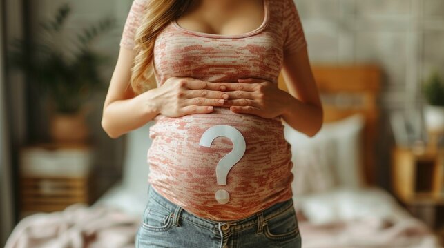 Pregnant woman with question mark on belly, hands on stomach, red t-shirt, blue jeans, and sunglasses in cozy bedroom. Curious and mysterious vibe.