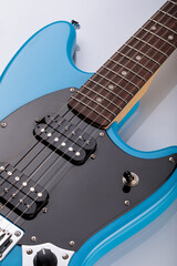 Close-up of blue electric guitar steel strings.  Close-up image. Studio shot. 