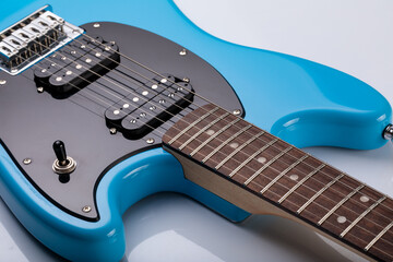 Close-up of blue electric guitar steel strings.  Close-up image. Studio shot. 