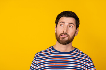 Photo of intelligent man with stylish beard dressed striped shirt confused look at offer empty...