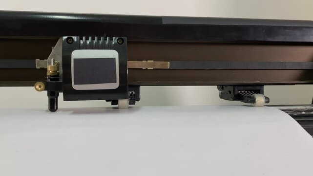 paper plotter. flatbed plotter for cutting. close-up flatbed plotter. slow motion video. High-quality shooting in 4K format.