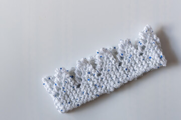 Christmas knitting - knitted cracker hats - reusable environmentally friendly knit crowns on white background 