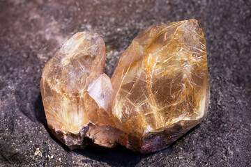 Yellow quartz mineral specimen with asbestos inclusions, showcasing unique natural formations